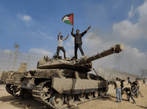 Palestinian fighters capture an Israeli tank during Operation Al-Aqsa Flood on October 7th